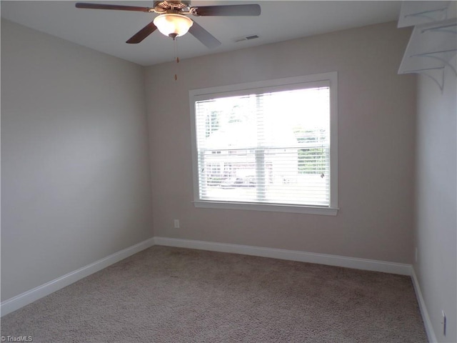 8003 Helison Ct, Stokesdale, NC 27357 - spare room with light colored carpet, a ceiling fan, and baseboards