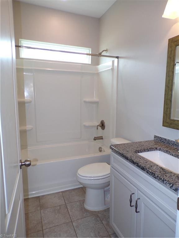 8003 Helison Ct, Stokesdale, NC 27357 - full bathroom with bathing tub / shower combination, toilet, vanity, and tile patterned floors