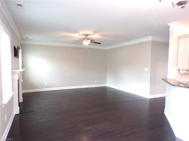 8003 Helison Ct, Stokesdale, NC 27357 - unfurnished living room with ceiling fan, dark wood-style floors, baseboards, and ornamental molding