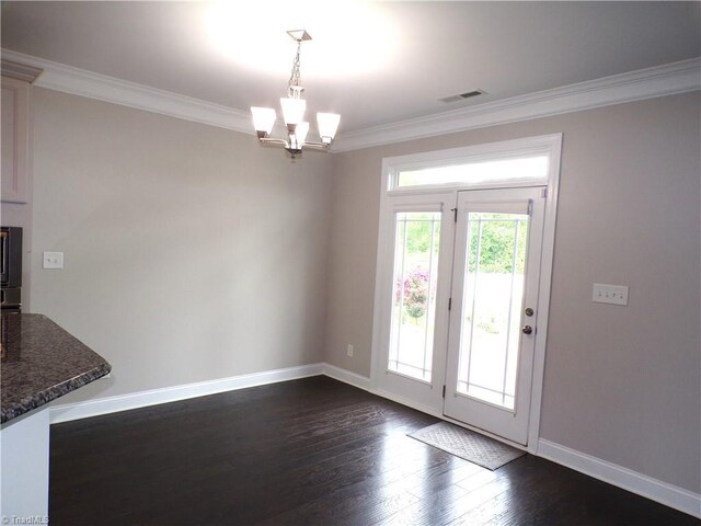 8003 Helison Ct, Stokesdale, NC 27357 - unfurnished dining area with ornamental molding, baseboards, dark wood-style flooring, and a chandelier