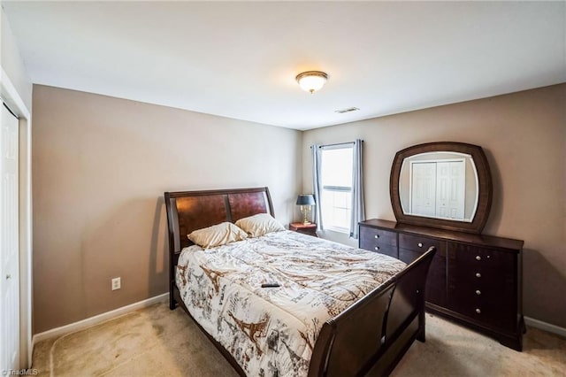 carpeted bedroom featuring a closet