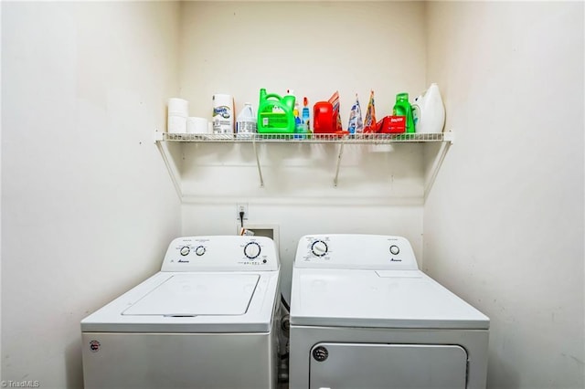 clothes washing area featuring independent washer and dryer