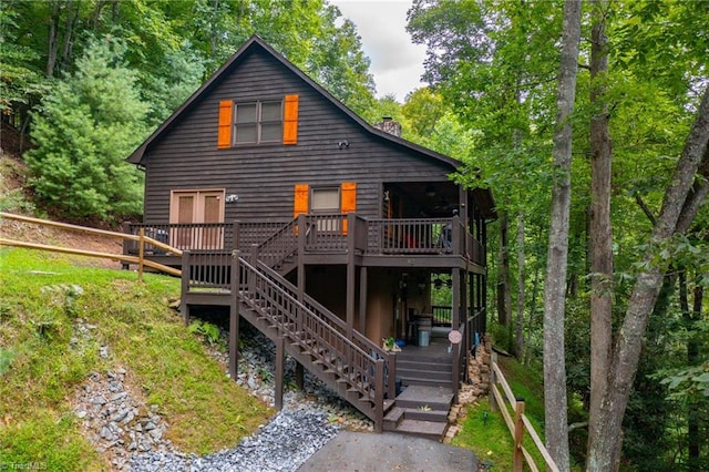 rear view of property with a deck