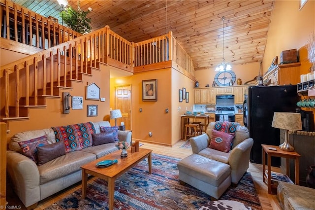 living room with high vaulted ceiling, wooden ceiling, a chandelier, and light hardwood / wood-style flooring