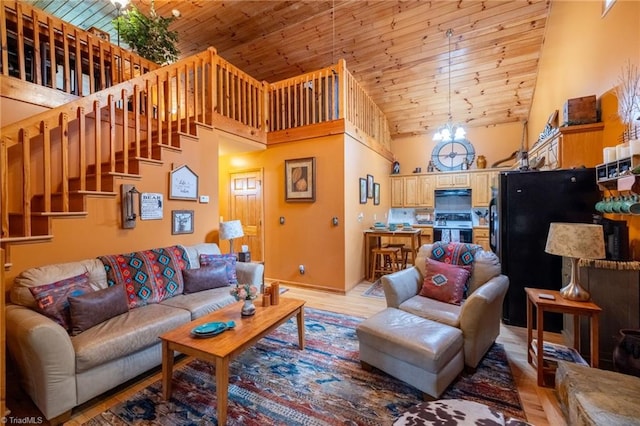 living room featuring high vaulted ceiling, wooden ceiling, a chandelier, and light hardwood / wood-style flooring