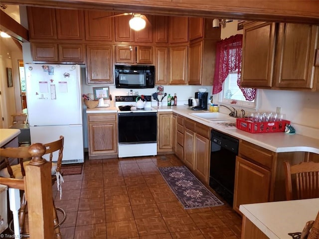 kitchen featuring black appliances and sink