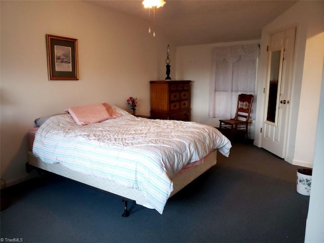 carpeted bedroom featuring vaulted ceiling