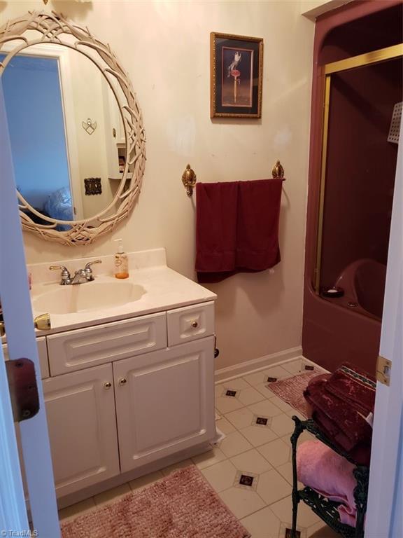 bathroom with vanity and tile patterned floors