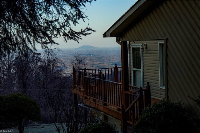 view of property exterior with a mountain view