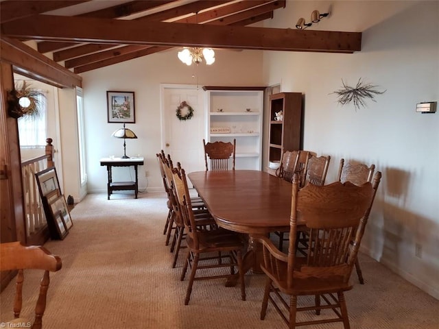 dining area with light carpet and lofted ceiling with beams