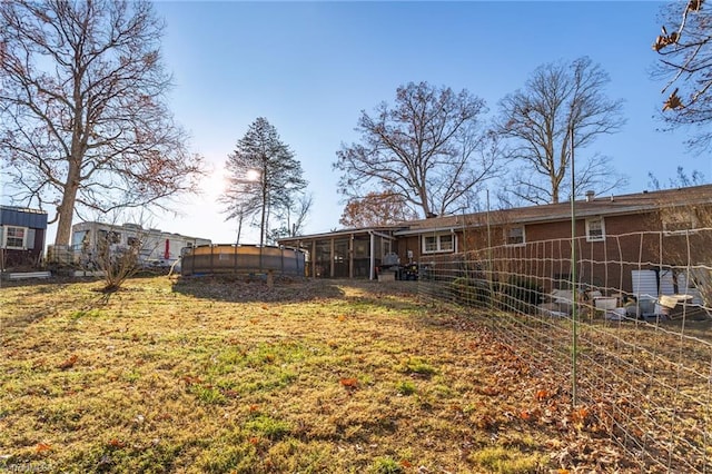 view of yard featuring a sunroom