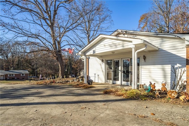 rear view of house featuring french doors