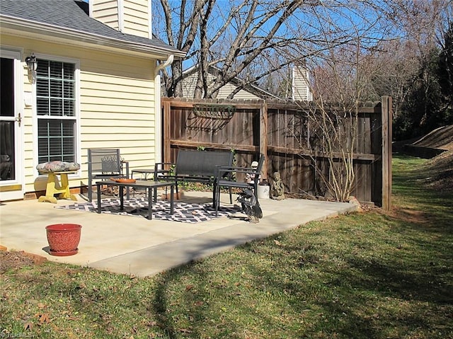 view of patio featuring fence