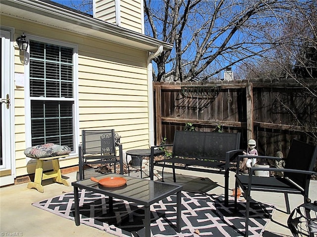 view of patio / terrace featuring fence