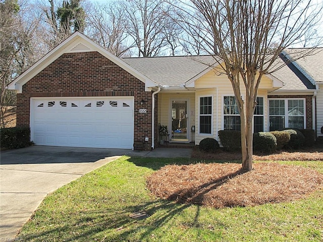 ranch-style home with a garage, brick siding, driveway, and a shingled roof