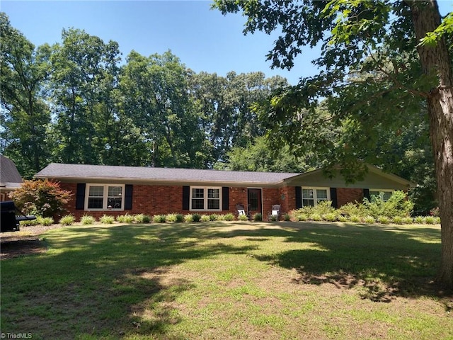 3977 Shannon Dr, Trinity, NC 27370 - ranch-style home featuring brick siding and a front yard