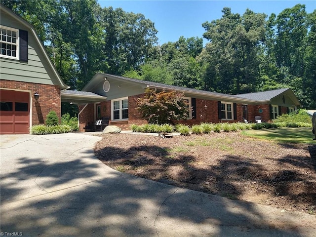 3977 Shannon Dr, Trinity, NC 27370 - view of front of home featuring brick siding, concrete driveway, and a garage