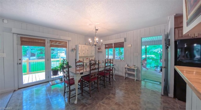 235 Hogan Bowers Rd, Thomasville, NC 27360 - dining room with a chandelier and a textured ceiling