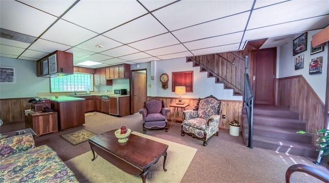 235 Hogan Bowers Rd, Thomasville, NC 27360 - living area featuring light carpet, wainscoting, stairs, a drop ceiling, and wooden walls