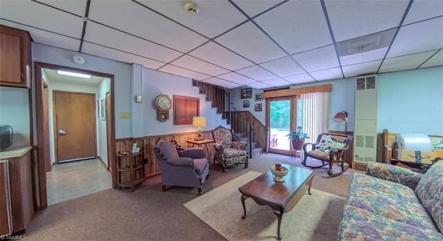 235 Hogan Bowers Rd, Thomasville, NC 27360 - living room with carpet, a paneled ceiling, stairway, and a wainscoted wall