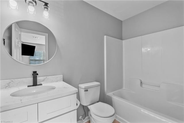 bathroom with vanity, toilet, and visible vents