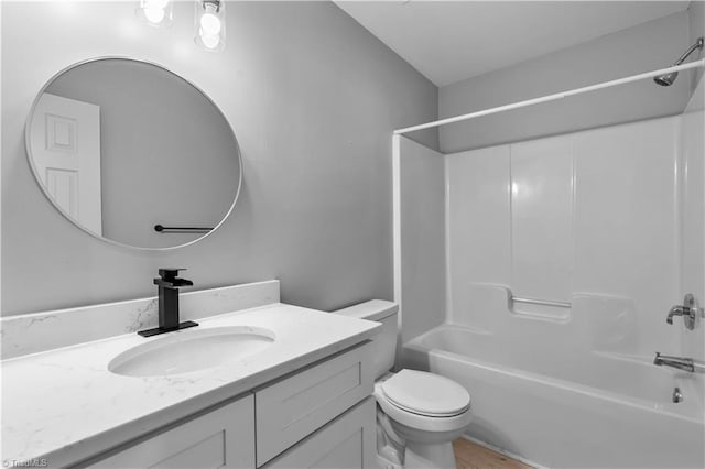 bathroom with shower / bath combination, vanity, toilet, and wood finished floors