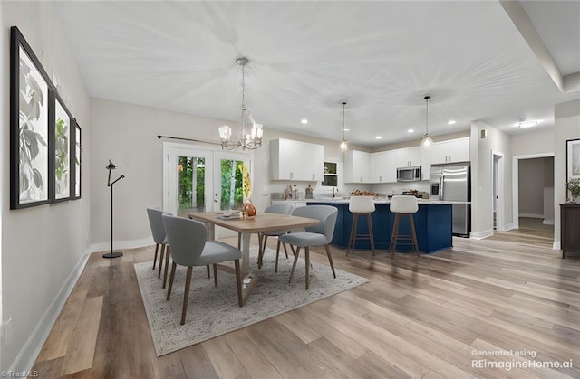 dining space featuring light wood-style flooring, baseboards, a chandelier, recessed lighting, and french doors