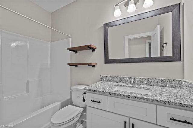 bathroom featuring vanity, toilet, and bathtub / shower combination