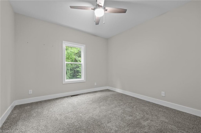 unfurnished room featuring baseboards, a ceiling fan, and carpet flooring