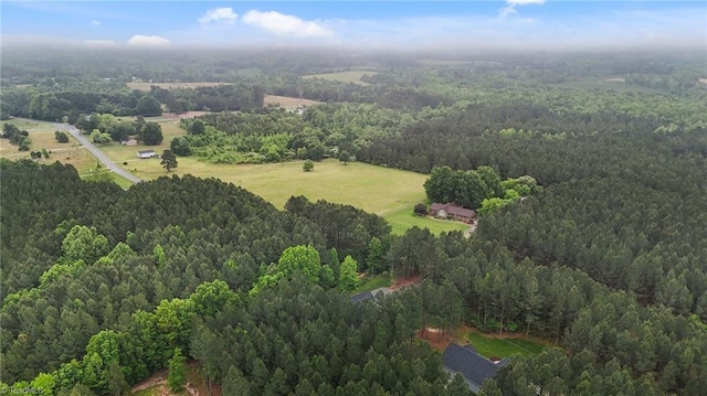 aerial overview of property's location featuring a heavily wooded area