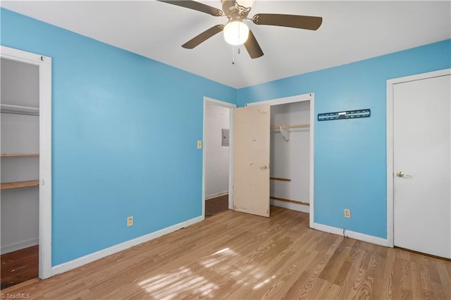 unfurnished bedroom featuring baseboards, ceiling fan, and wood finished floors