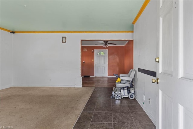 entryway featuring a ceiling fan, baseboards, and tile patterned flooring
