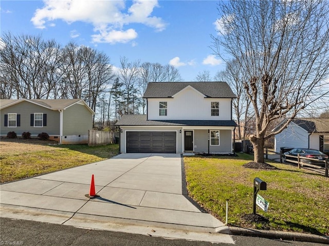 front facade with a garage and a front lawn