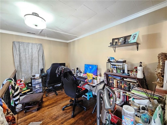 office featuring attic access, crown molding, and wood finished floors