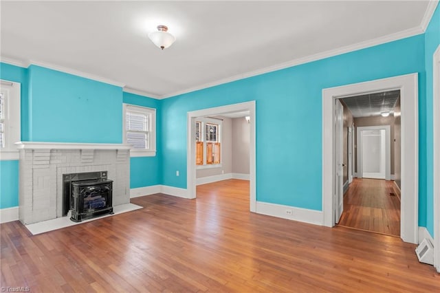 unfurnished living room with crown molding and wood-type flooring