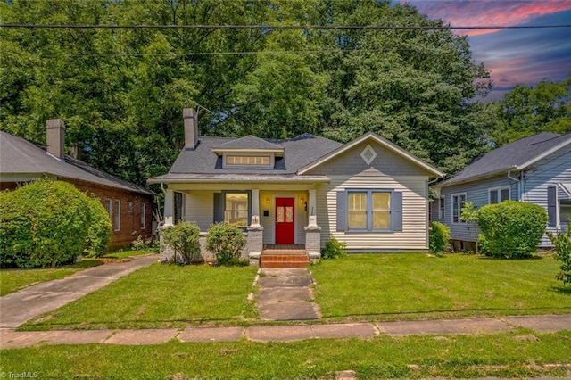 524 Horah St, Salisbury, NC 28144 - bungalow-style house with a front lawn, a chimney, and covered porch
