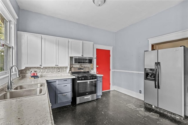 524 Horah St, Salisbury, NC 28144 - kitchen with stainless steel appliances, white cabinets, decorative backsplash, and light countertops