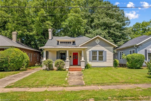524 Horah St, Salisbury, NC 28144 - bungalow featuring a front lawn, a chimney, and a porch