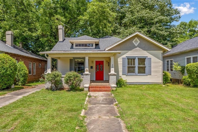 524 Horah St, Salisbury, NC 28144 - view of front facade featuring a front lawn, a chimney, a porch, and roof with shingles