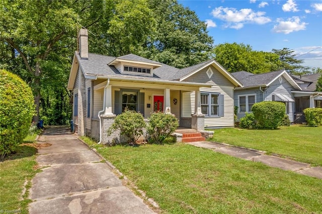 524 Horah St, Salisbury, NC 28144 - bungalow with a chimney, a porch, a front lawn, driveway, and a shingled roof