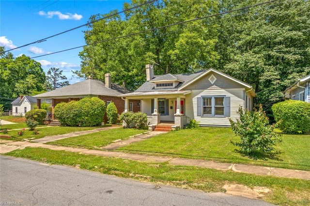 524 Horah St, Salisbury, NC 28144 - bungalow-style home with a porch, a front lawn, and a chimney