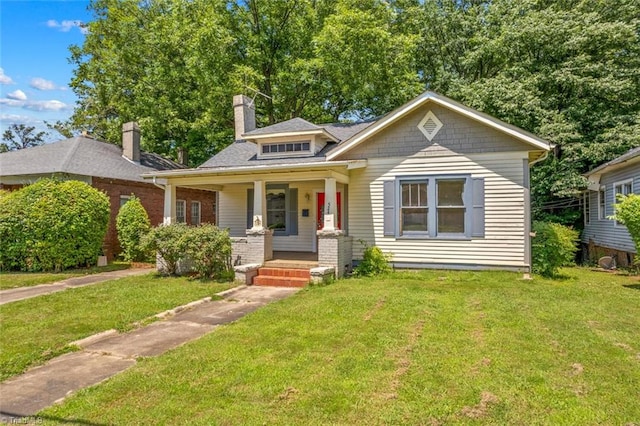 524 Horah St, Salisbury, NC 28144 - bungalow-style home featuring covered porch, a front lawn, and a chimney