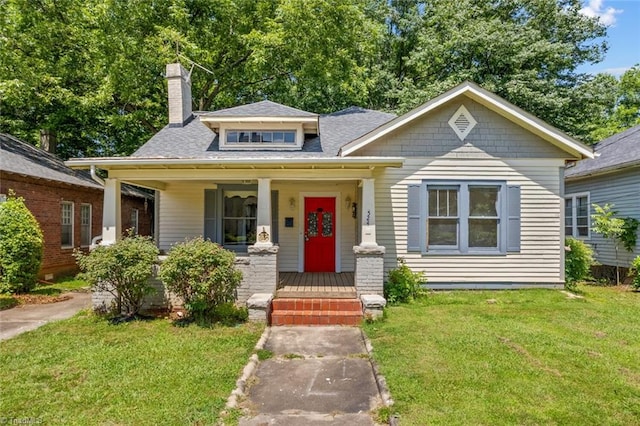 524 Horah St, Salisbury, NC 28144 - bungalow-style house with covered porch, a front yard, a chimney, and roof with shingles