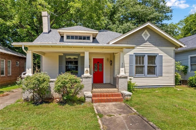 524 Horah St, Salisbury, NC 28144 - bungalow-style house with a front lawn, a porch, a chimney, and roof with shingles