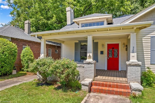 524 Horah St, Salisbury, NC 28144 - view of front of property with covered porch, a shingled roof, and a chimney