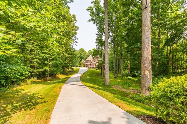 view of community featuring a lawn