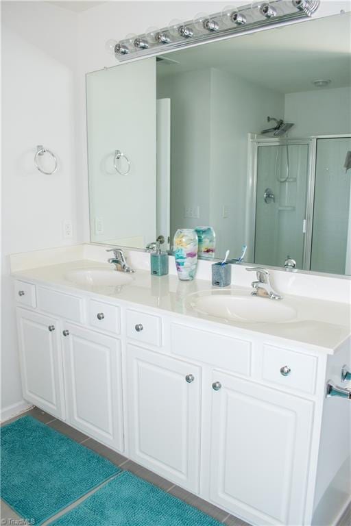 3029 Zacharys Keep Ct, Winston-Salem, NC 27103 - bathroom with a stall shower, double vanity, and tile patterned floors