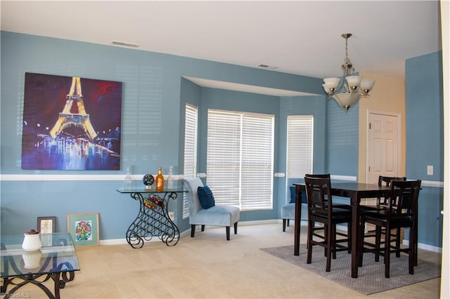 3029 Zacharys Keep Ct, Winston-Salem, NC 27103 - carpeted dining room with a chandelier and baseboards