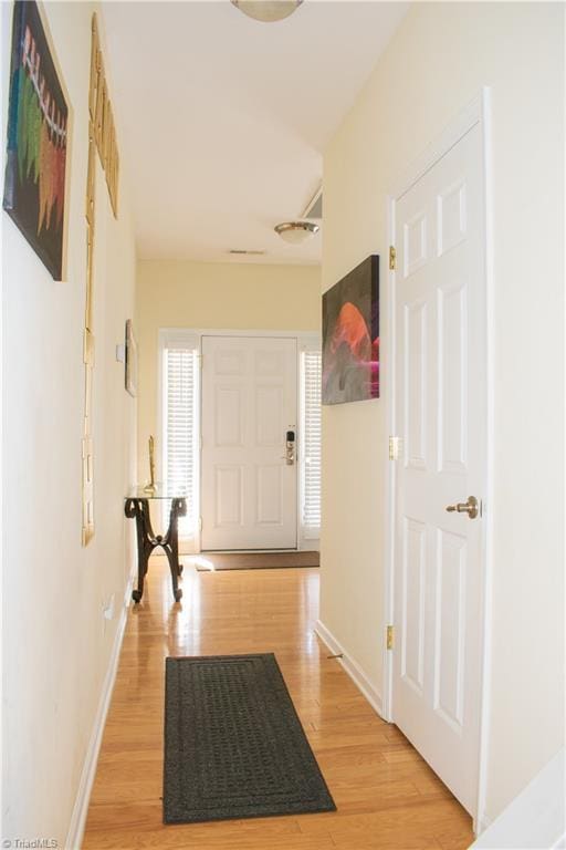 3029 Zacharys Keep Ct, Winston-Salem, NC 27103 - hallway with light wood-style flooring and baseboards