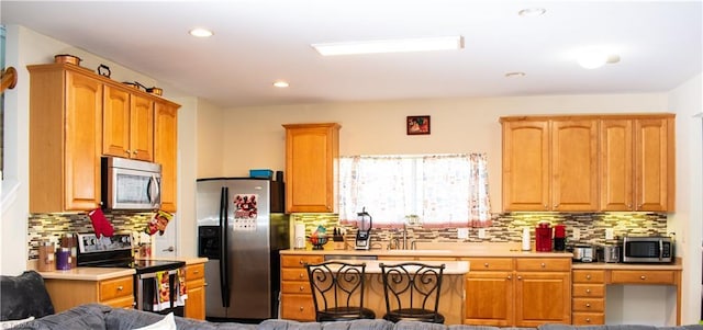 3029 Zacharys Keep Ct, Winston-Salem, NC 27103 - kitchen featuring stainless steel appliances, decorative backsplash, light countertops, and recessed lighting